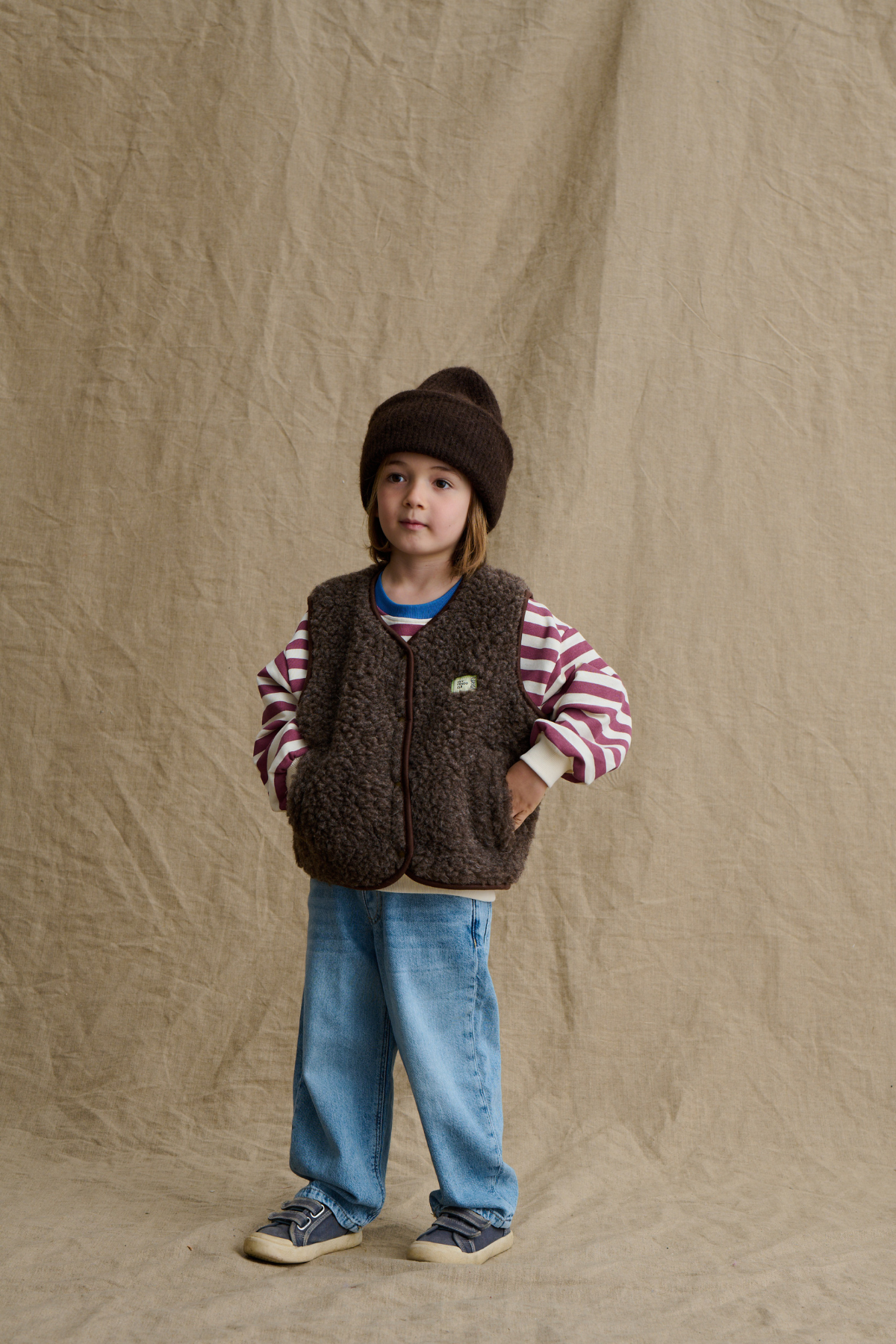 Wollweste Kids "Tiny Tornado Club" | Espresso