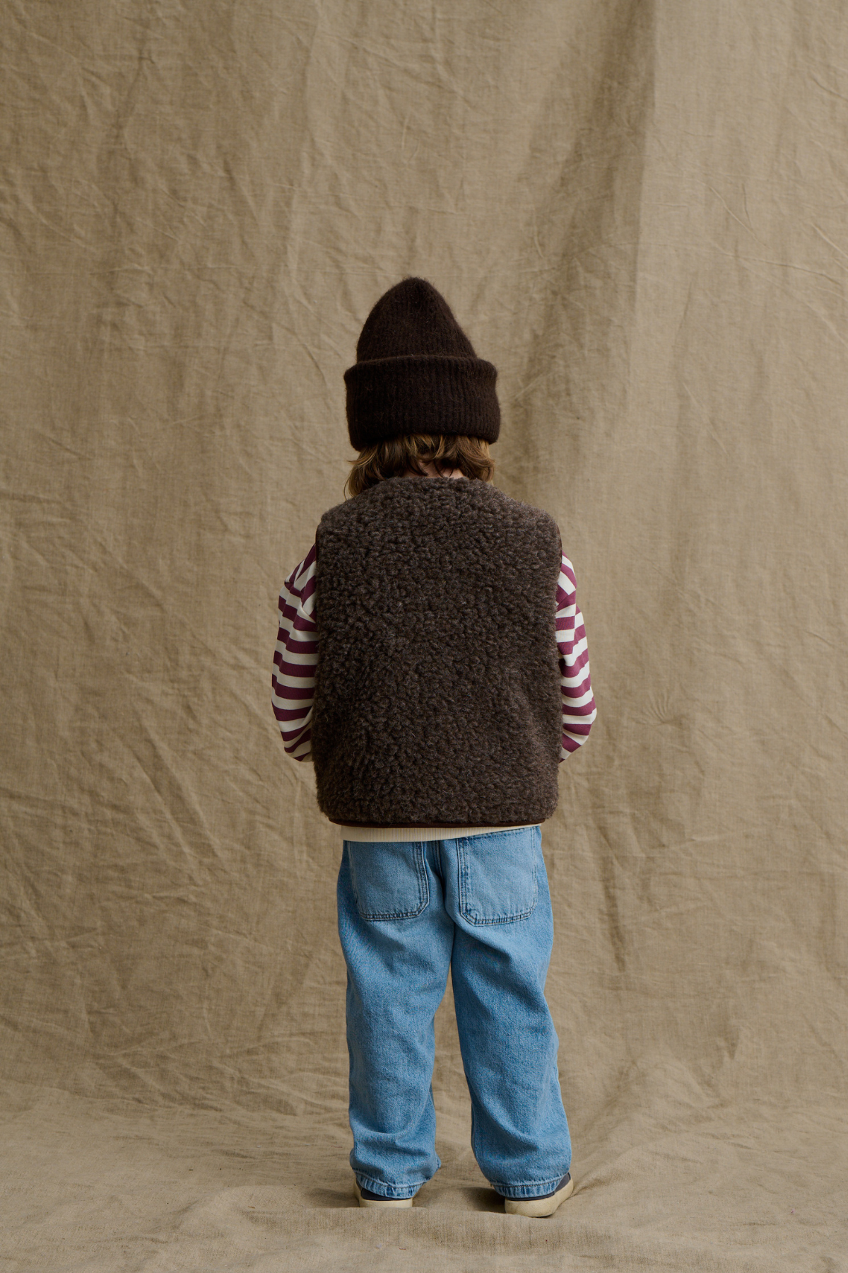 Wollweste Kids "Tiny Tornado Club" | Espresso
